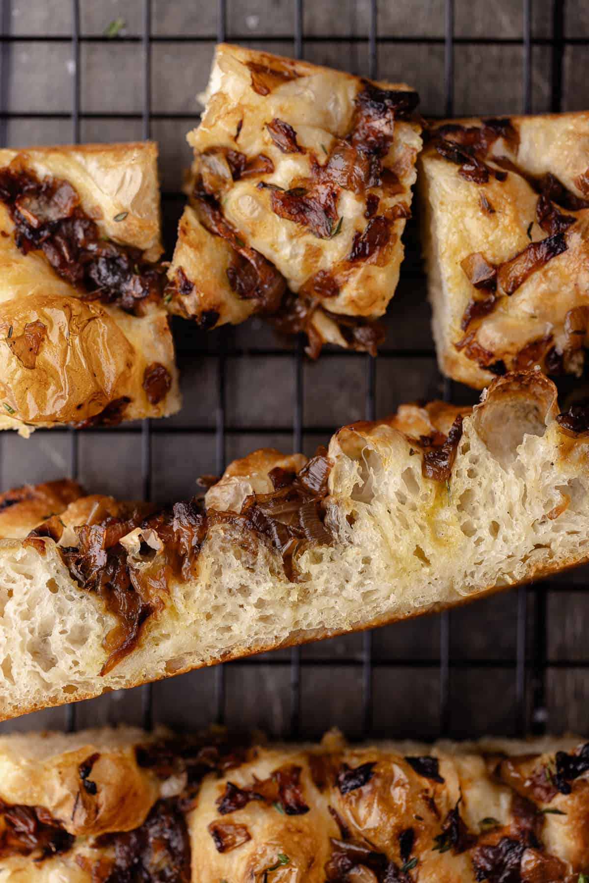 Overnight Caramelized onion focaccia on a wire rack.