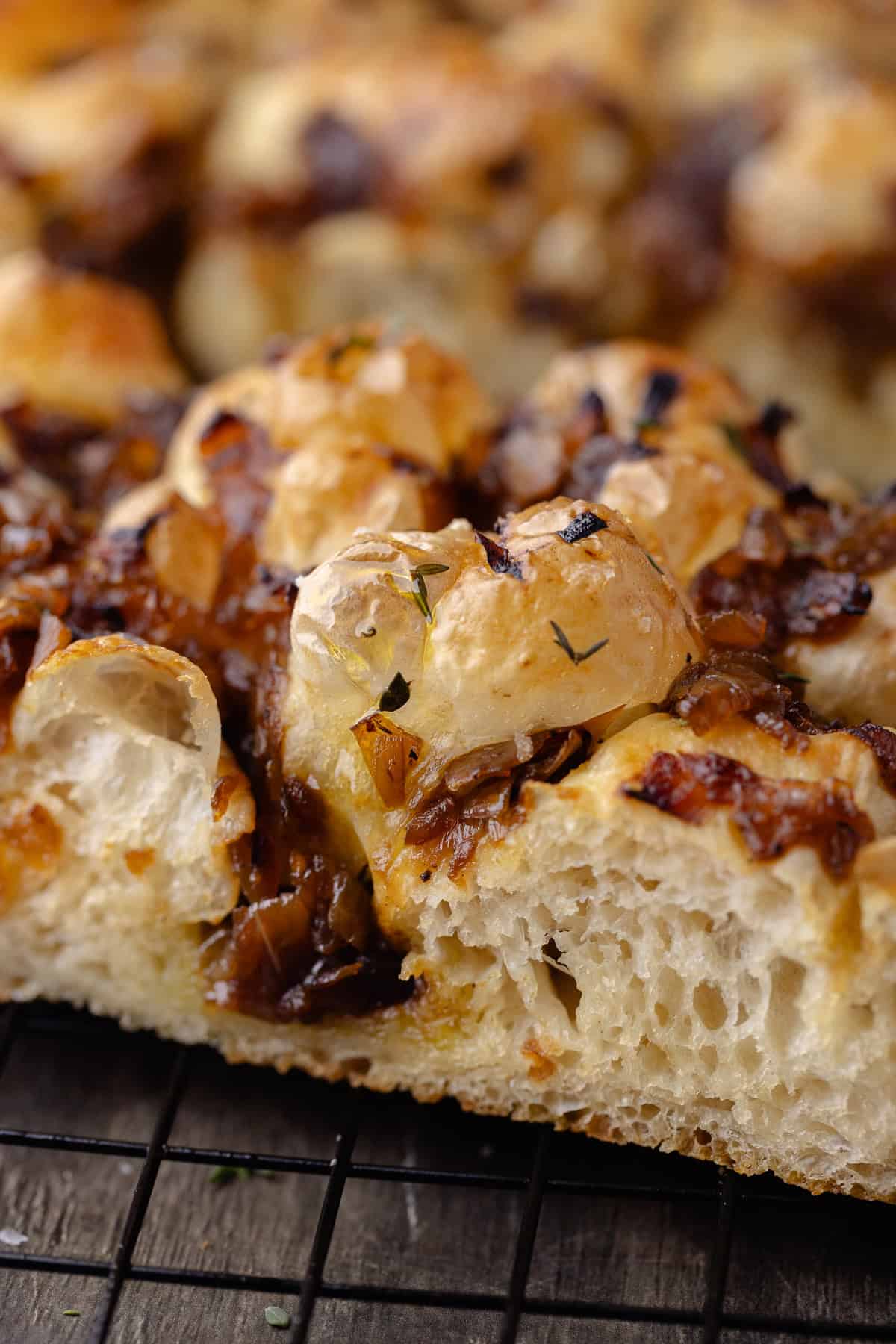 A close up of the side of the overnight caramelized onion focaccia.