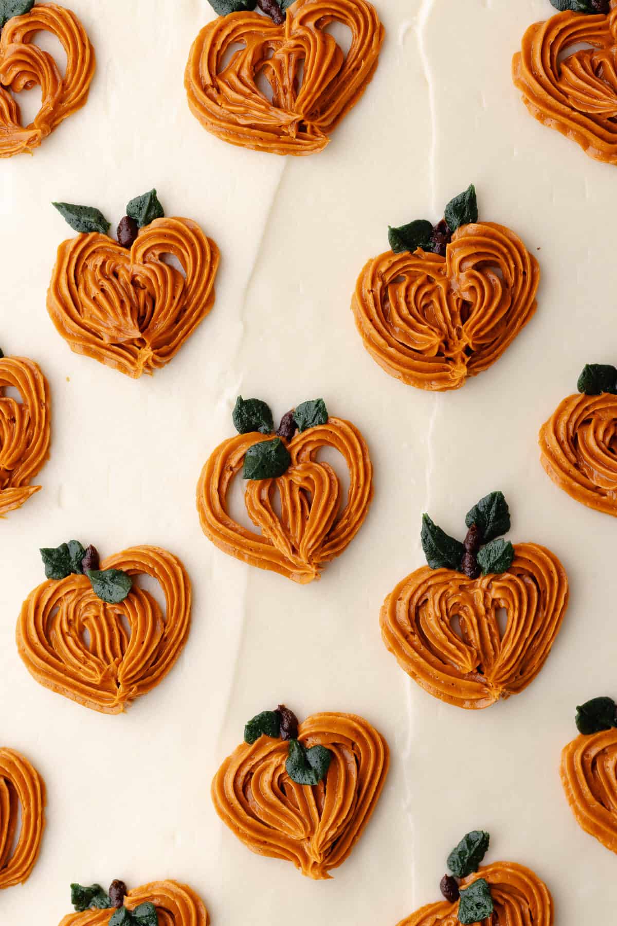 Close up of the top of the cake, showing the piped pumpkins.