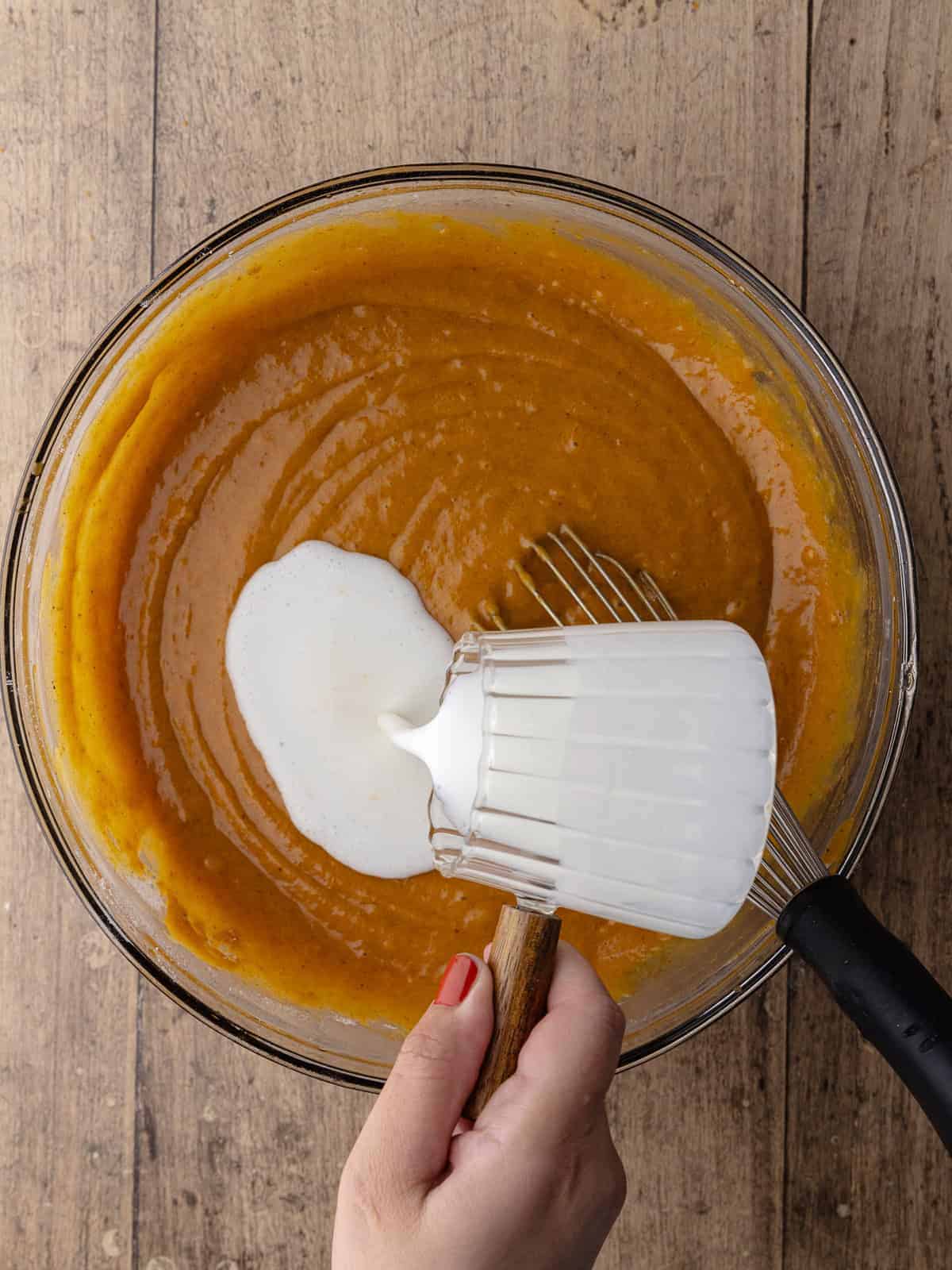 Buttermilk is added to the pumpkin sugar mixture.