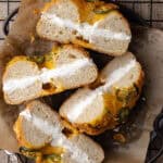 Jalapeño cheddar bagels filled with cream cheese schmear on a plate featured photo.