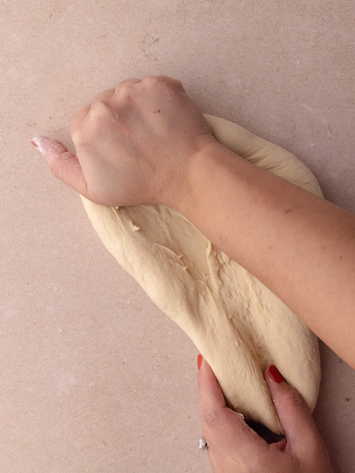 The bagel dough is kneaded by hand.