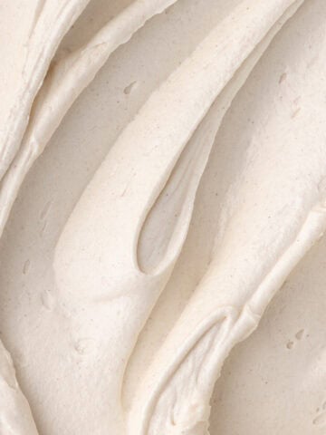 Close up of cinnamon maple cream cheese frosting featured photo.