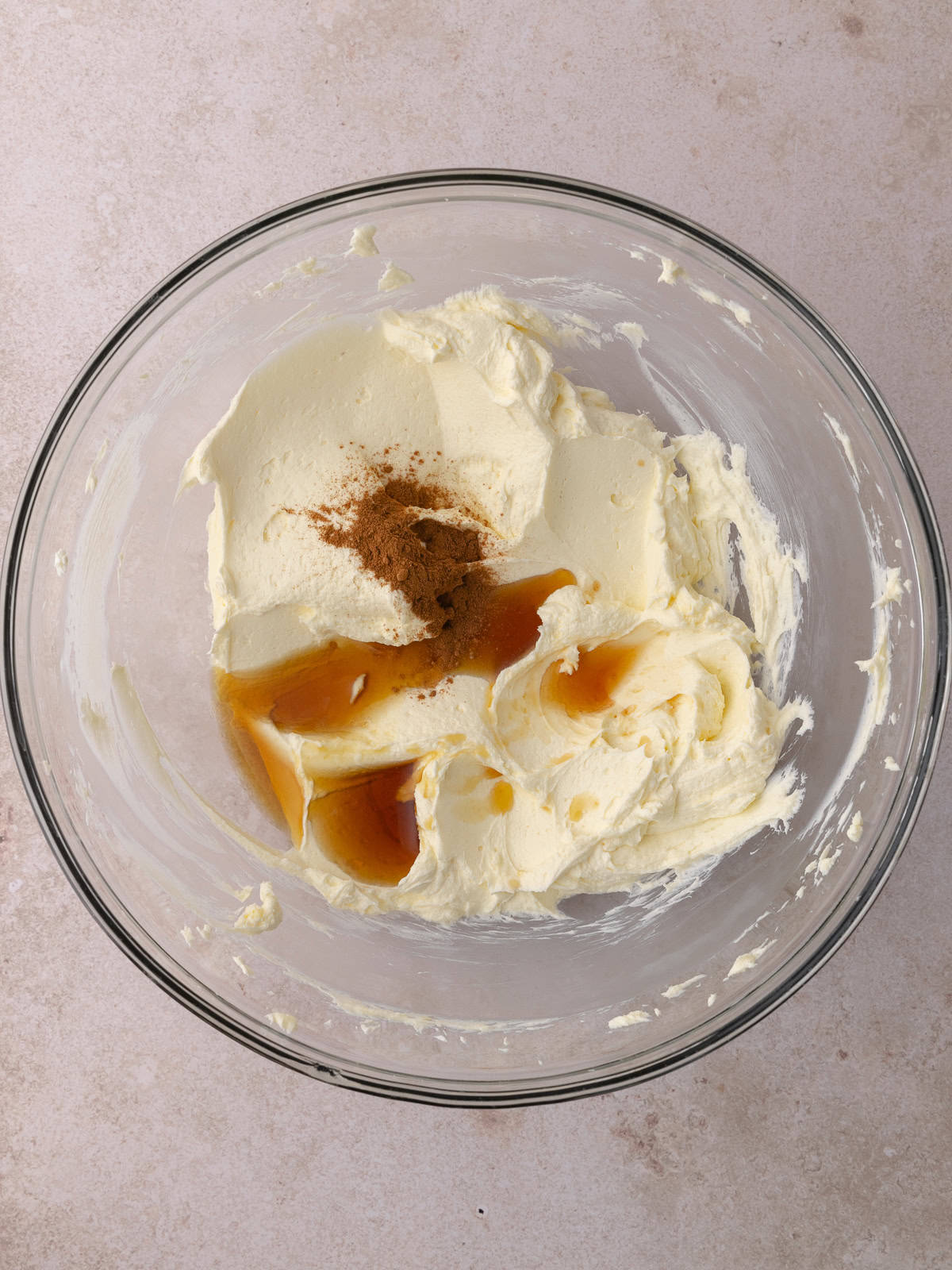 Maple syrup, maple extract and cinnamon are added to the cream cheese/butter mixture.