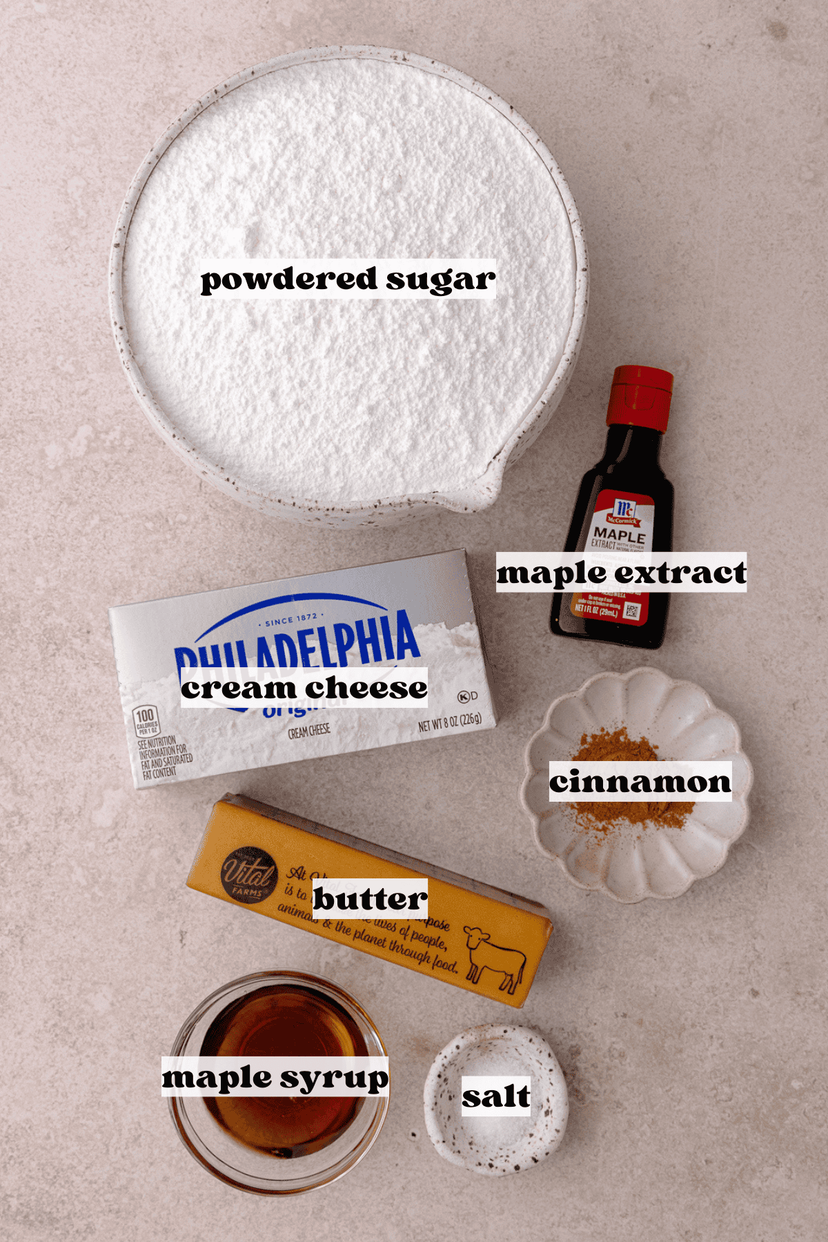 Maple Cinnamon Cream Cheese Frosting ingredients which include, cream cheese, butter, maple syrup, maple extract, salt, cinnamon and powdered sugar.