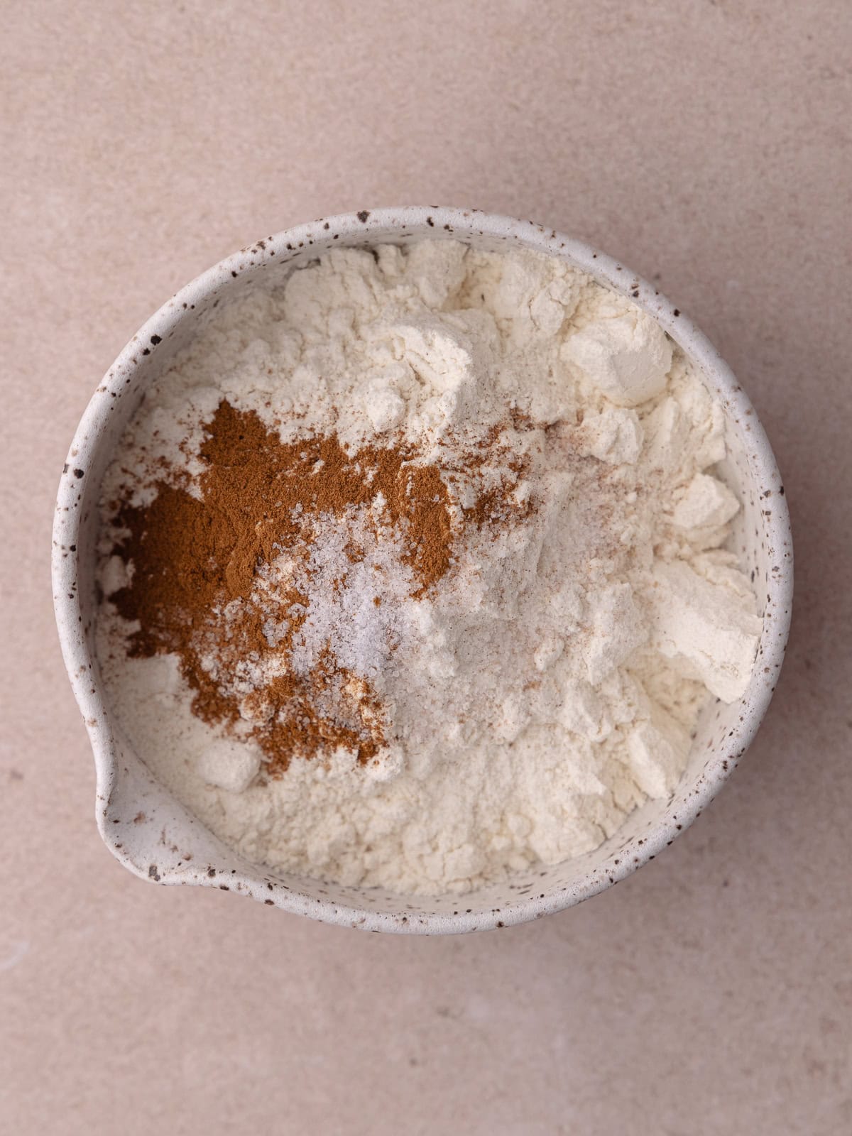 All-purpose flour, cinnamon and salt are in a small mixing bowl.