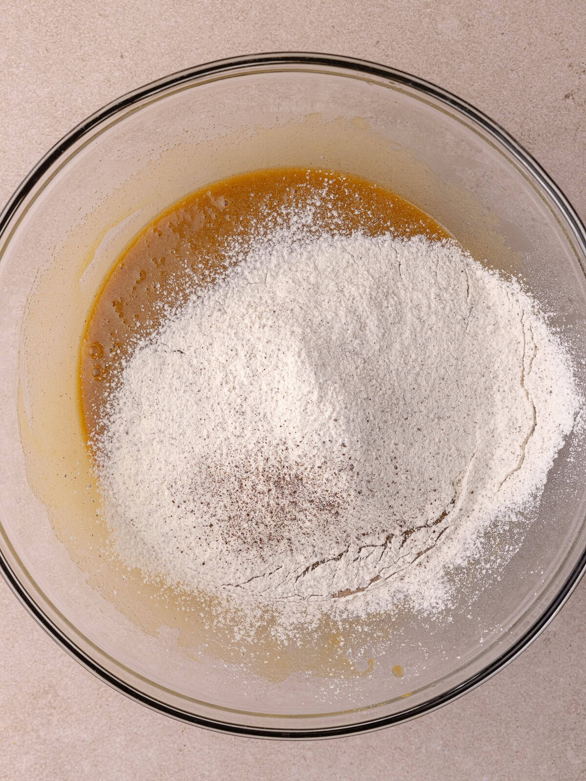 All-purpose flour, espresso powder and salt are sifted into the wet ingredients.