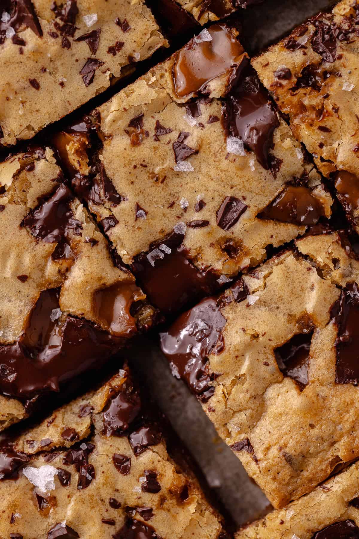 A close up of toffee espresso squares sitting on a baking sheet.