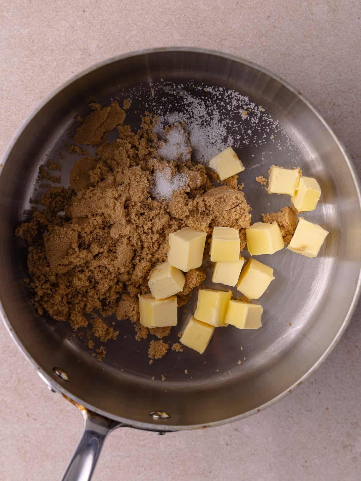 Cubed butter, brown sugar and salt are in a small saucepan.