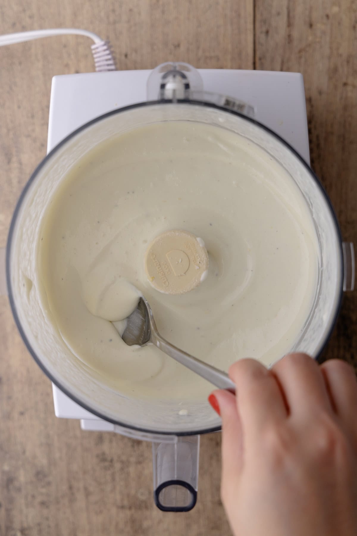 Creamy whipped feta is ready and in the bowl of the food processor.