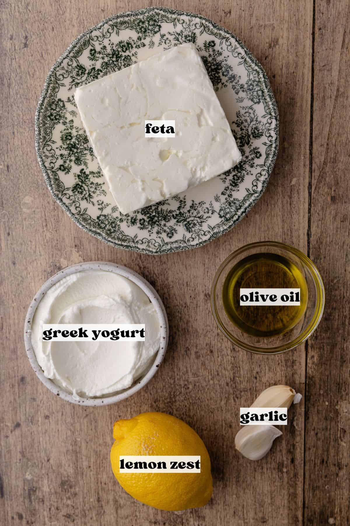 Whipped feta ingredients which include, block of feta, Greek yogurt, lemon, garlic and extra-virgin olive oil.