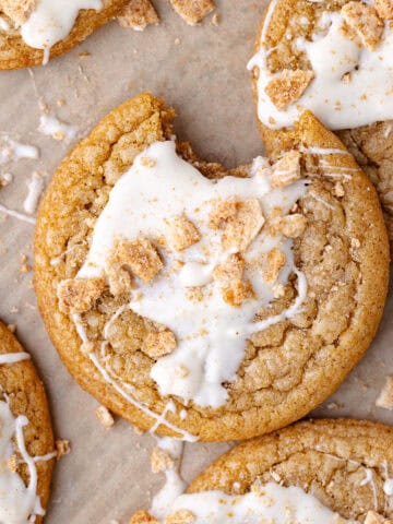 Soft and chewy cinnamon toast crunch cookies drizzled with white chocolate and crushed cinnamon toast crunch cereal featured photo.