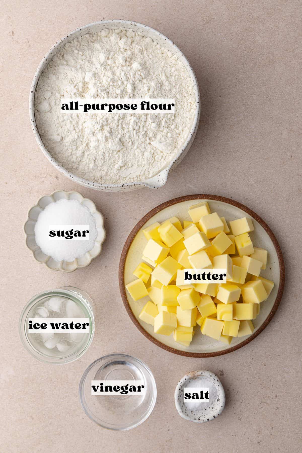 Easy homemade flaky all-butter pie crust ingredients which include, all-purpose flour, butter, sugar, salt, vinegar and ice water.