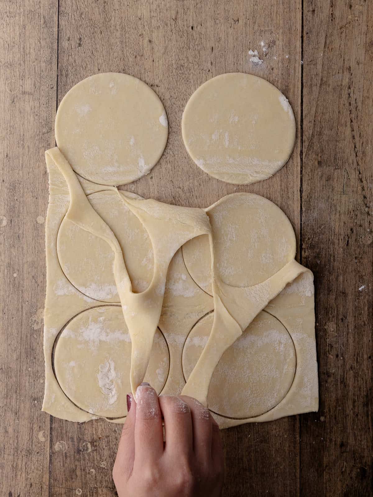 Puff pastry is cut into 6 round discs.