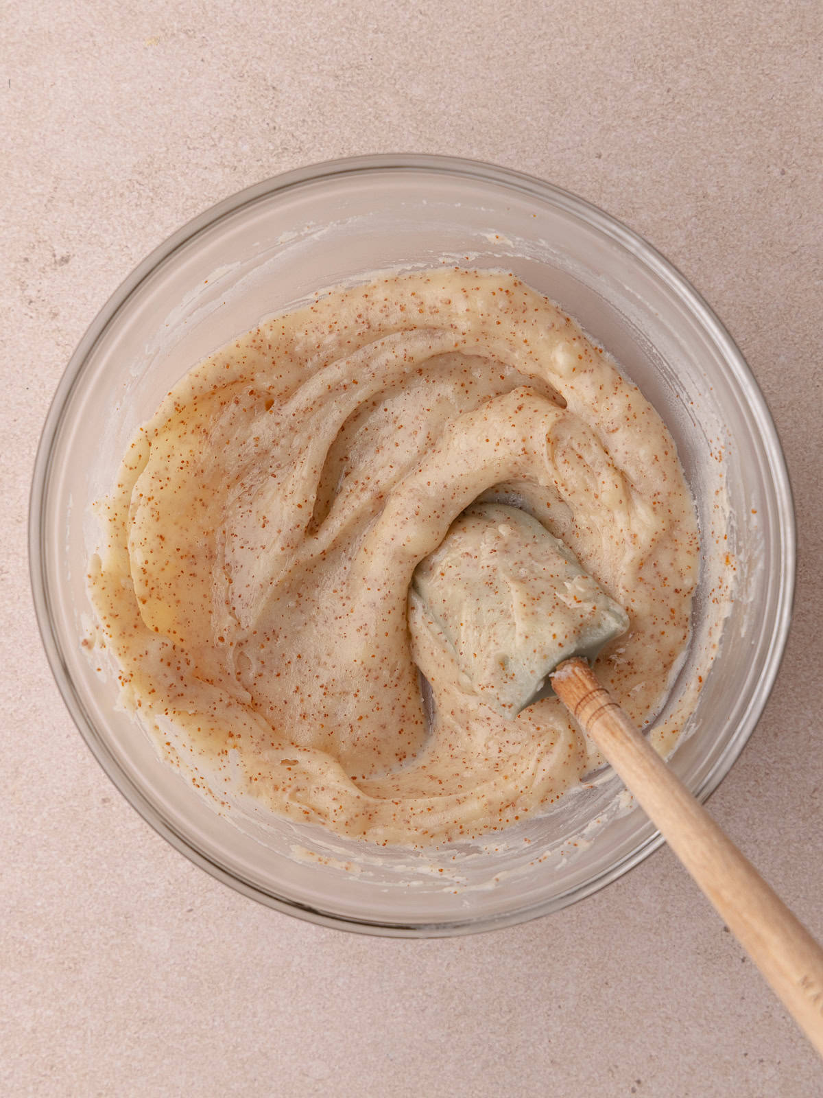 Brown butter has solidified and softened and sitting in a small mixing bowl.