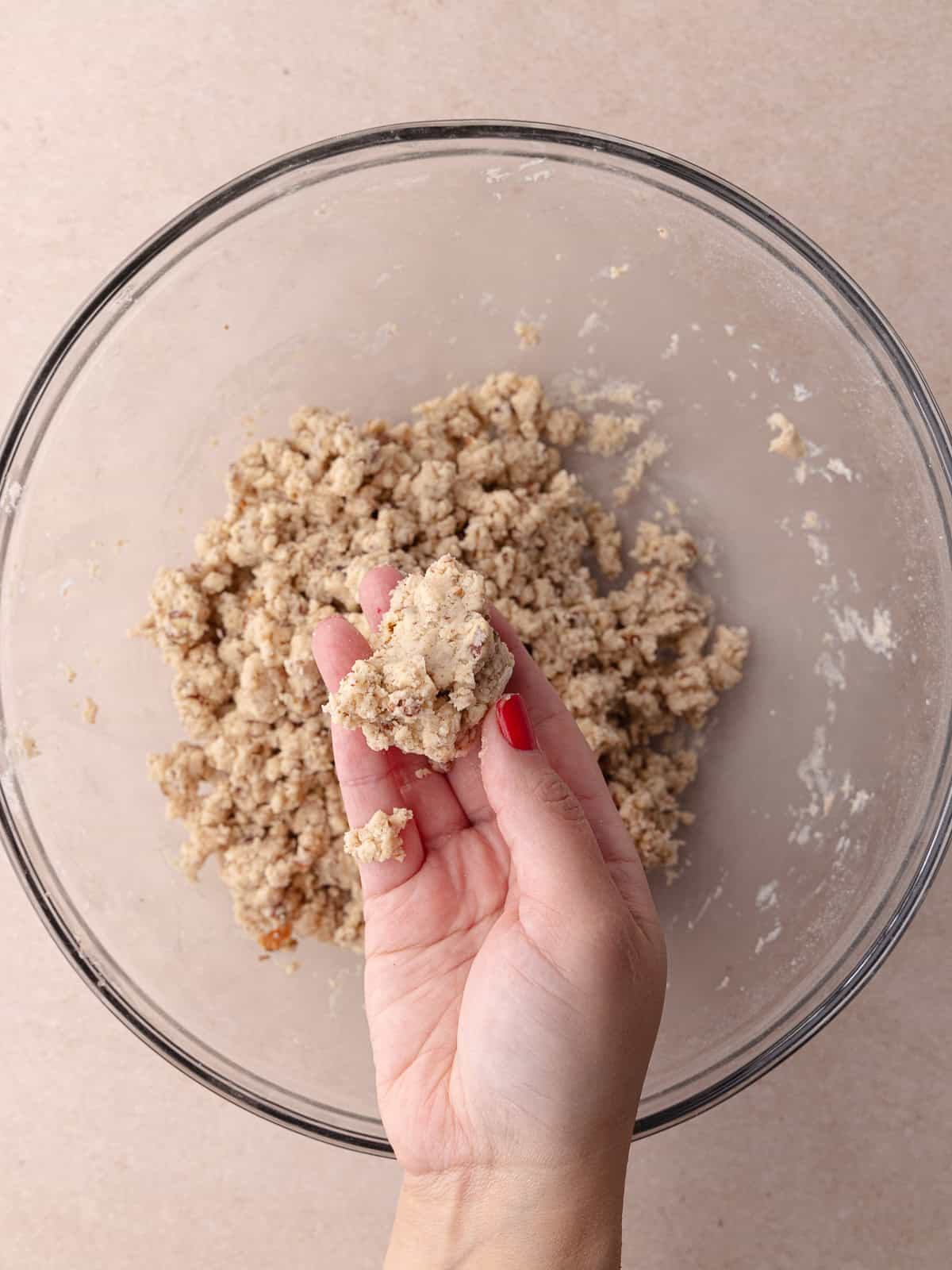 Brown butter pecan shortbread cookie dough comes together when squeezed.