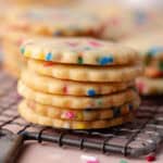 A stack of funfetti shortbread cookies on a wire rack feature photo.