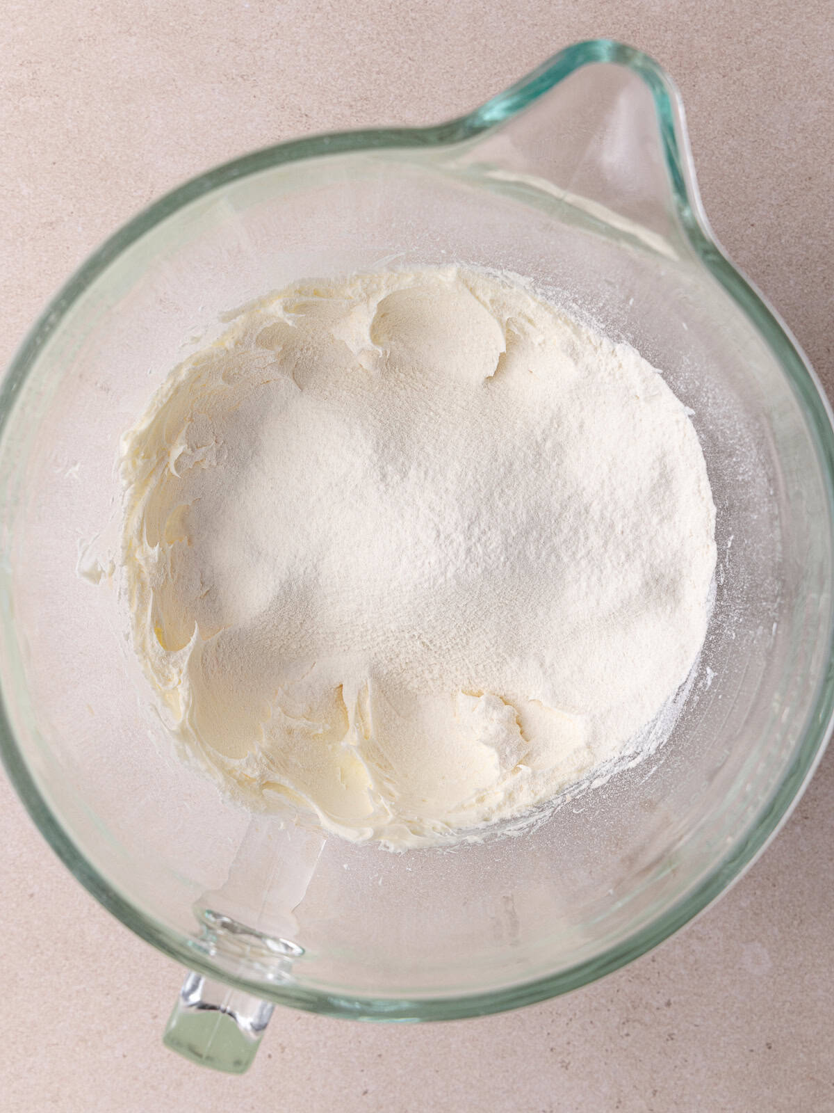 All-purpose flour is sifted into the whipped butter/sugar mixture.