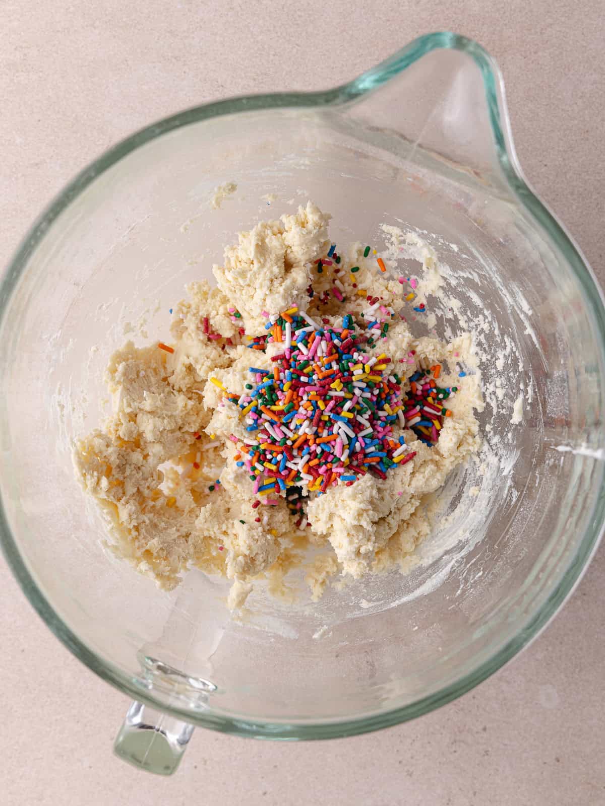 Rainbow sprinkles are added to the shortbread cookie dough.