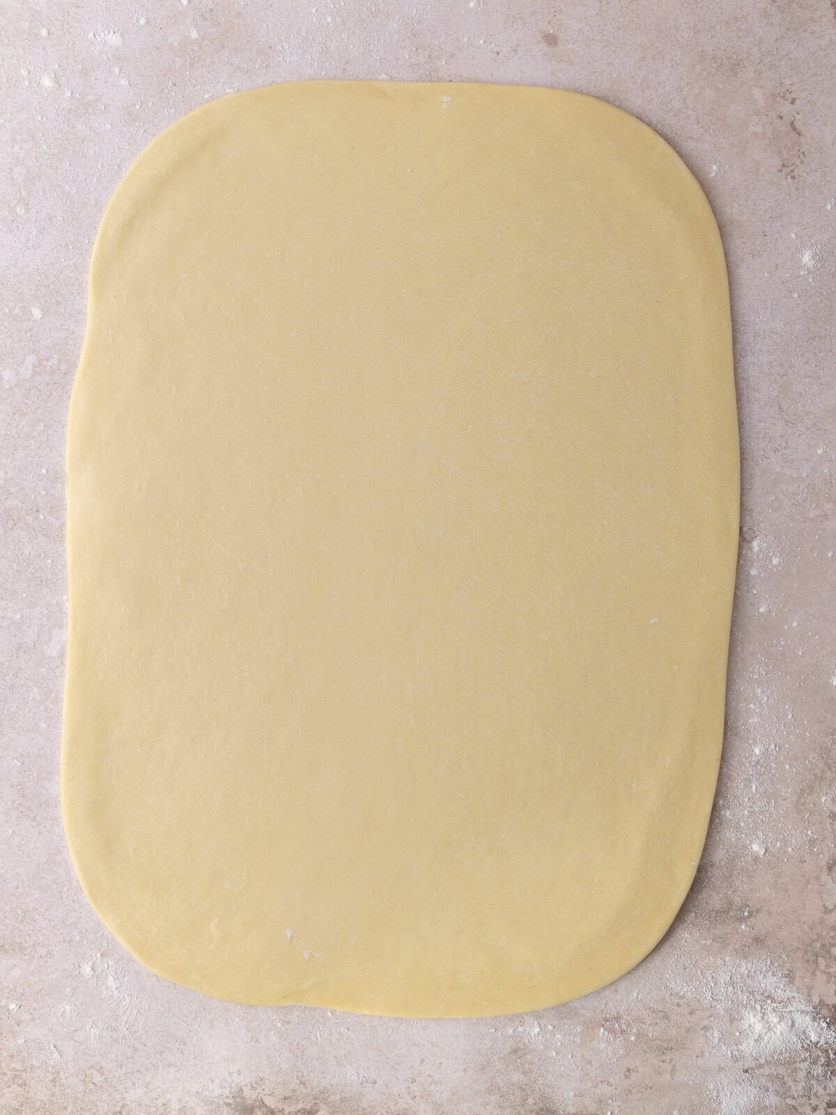 The dough is rolled out to a 12x16 inch rectangle.