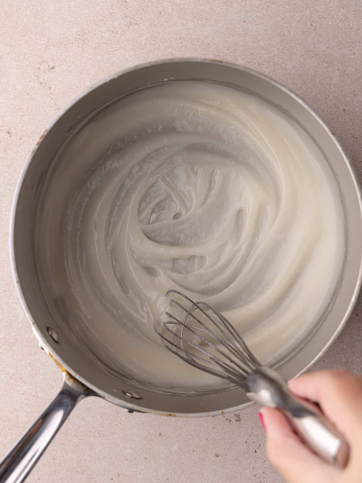 Tangzhong is cooked in a small saucepan until thickened.