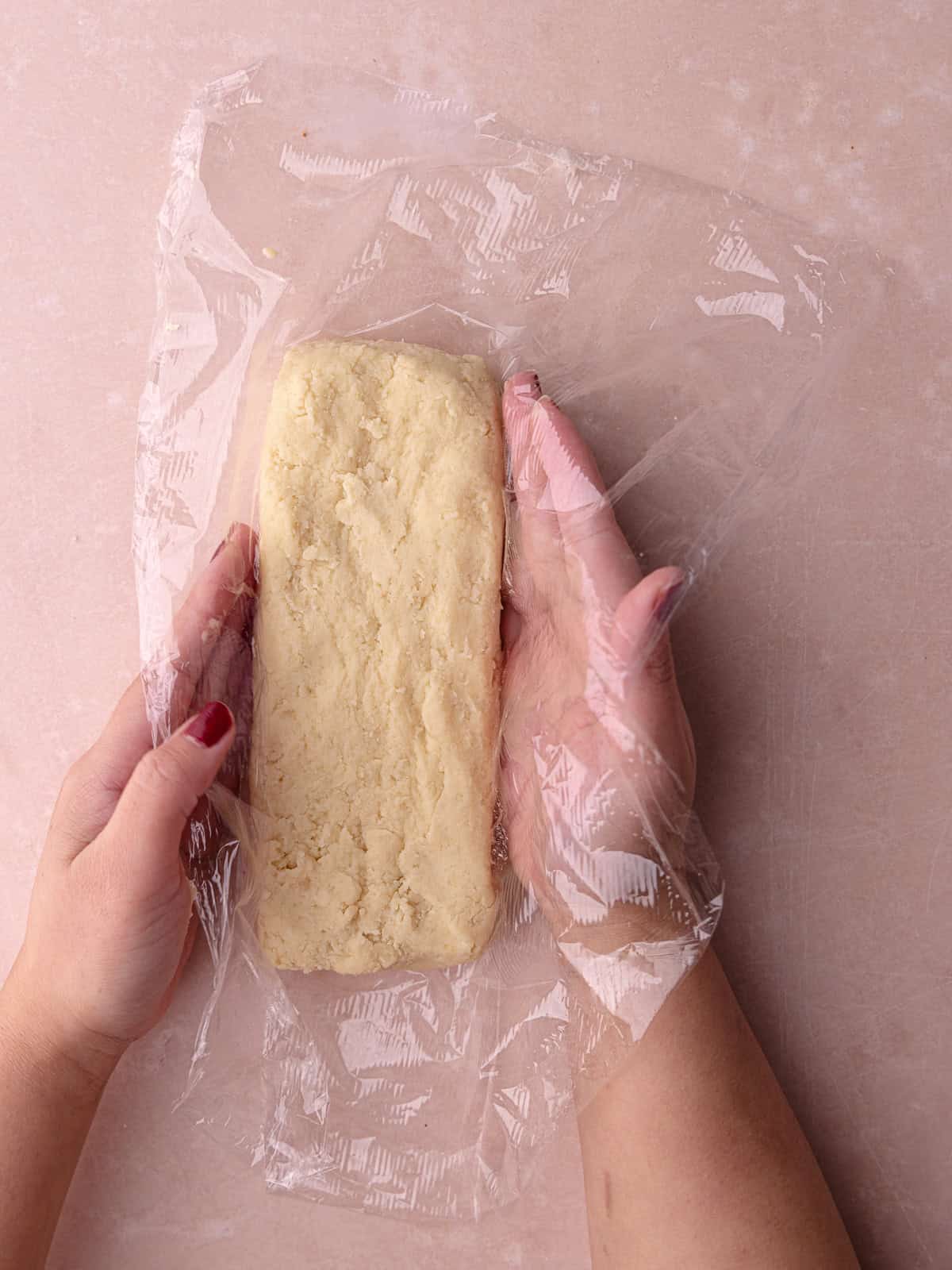 Hawaiian macadamia nut shortbread cookies are shaped into a long rectangle.