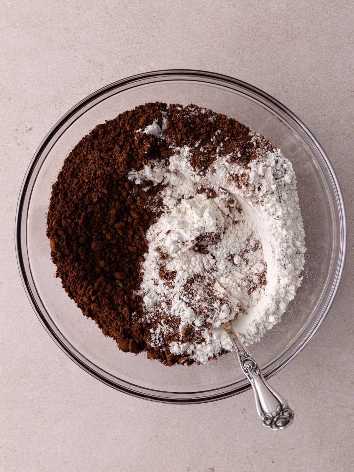 All-purpose flour and unsweetened cocoa powder are combined in a medium bowl.