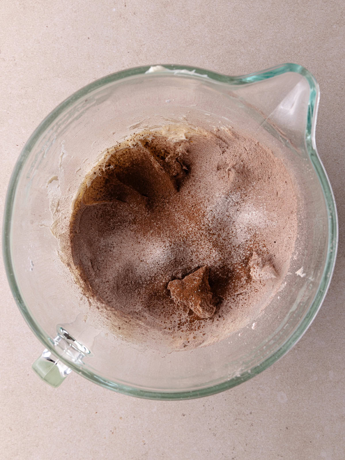 Flour mixture is sifted into the butter/sugar mixture.