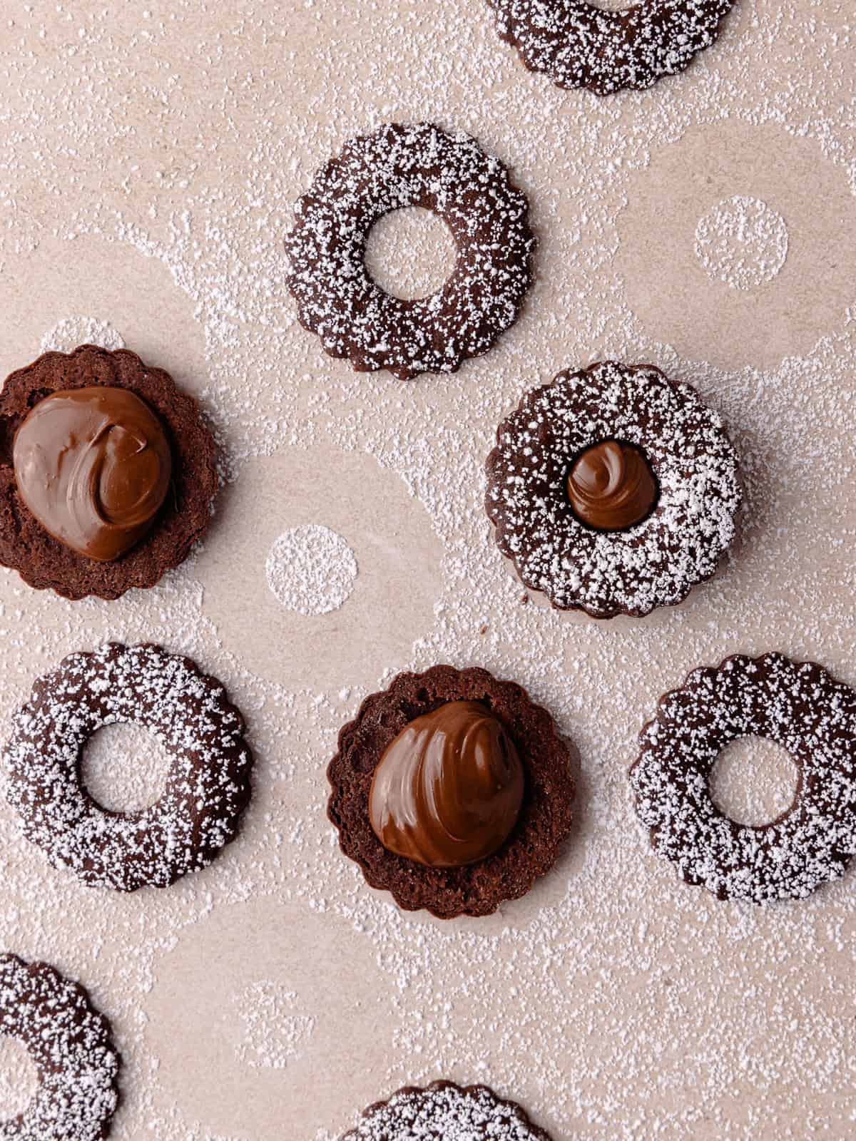 The bottom linzer cookies are filled with Nutella.