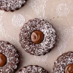 Nutella linzer sandwich cookies are dusted with powdered sugar and filled with Nutella, feature photo.