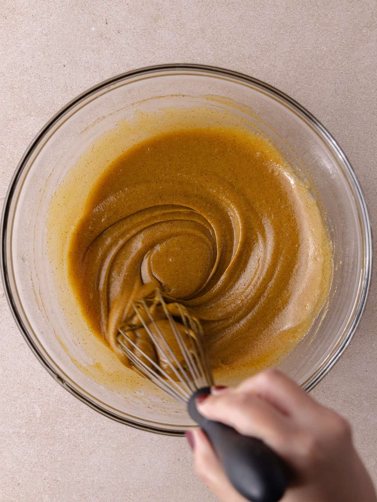 Egg, yolk and vanilla are whisked with the butter and sugar mixture.