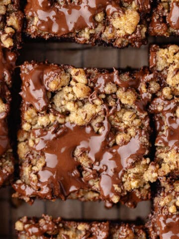 Close up chocolate coffee cake cut into squares feature photo.