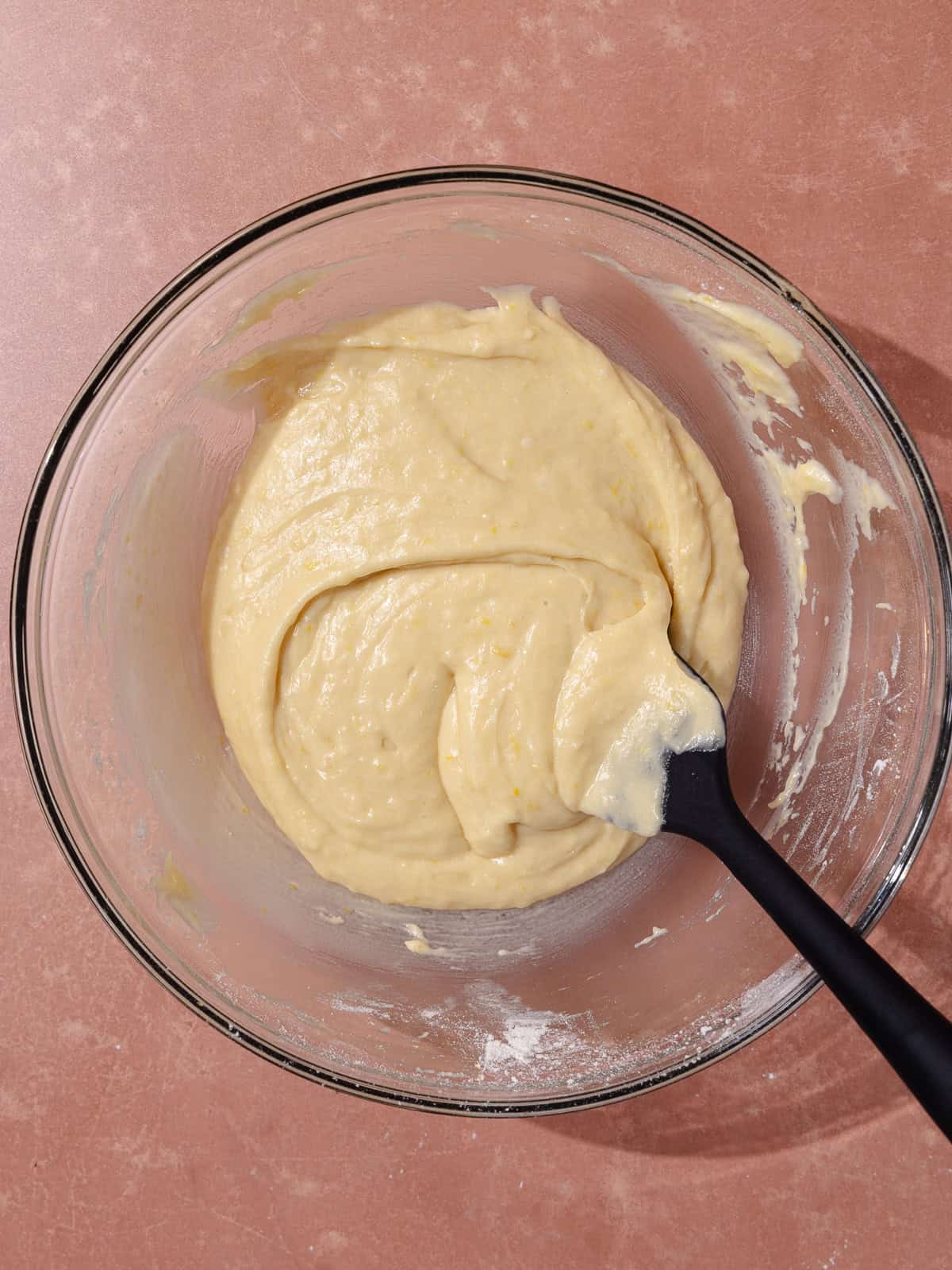 Lemon vanilla cake batter is in a large mixing bowl.