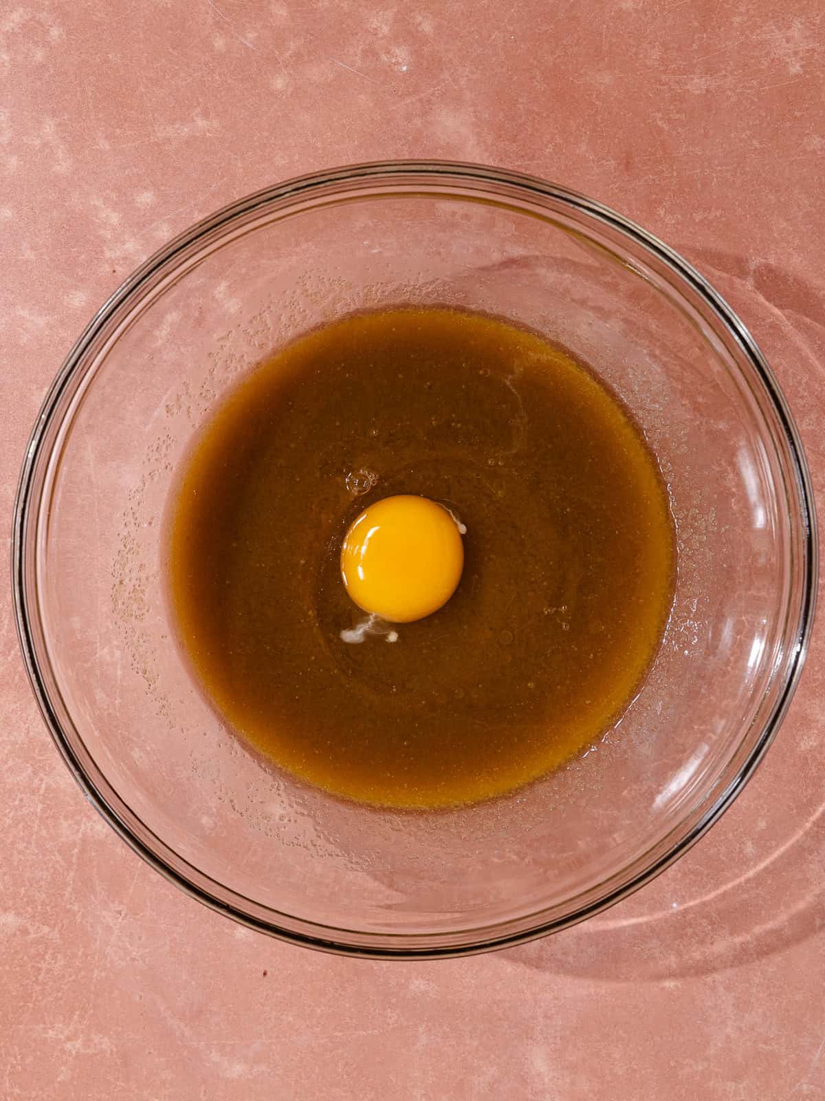 An egg is added to the wet ingredients.