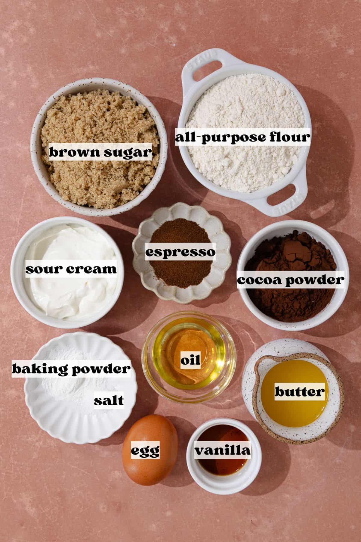 Chocolate gooey butter cake ingredients, including all-purpose flour, unsweetened cocoa powder, baking powder, salt, butter, vanilla, espresso, sour cream, egg, melted butter, oil and brown sugar.