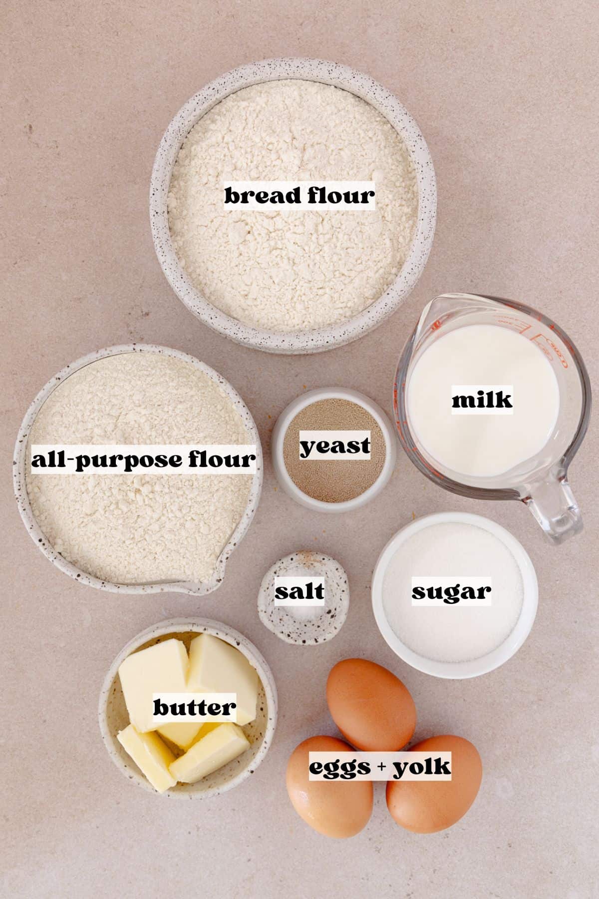 Brioche dough donut ingredients, which include, bread flour, all-purpose flour, milk, eggs, butter, salt, sugar and yeast.