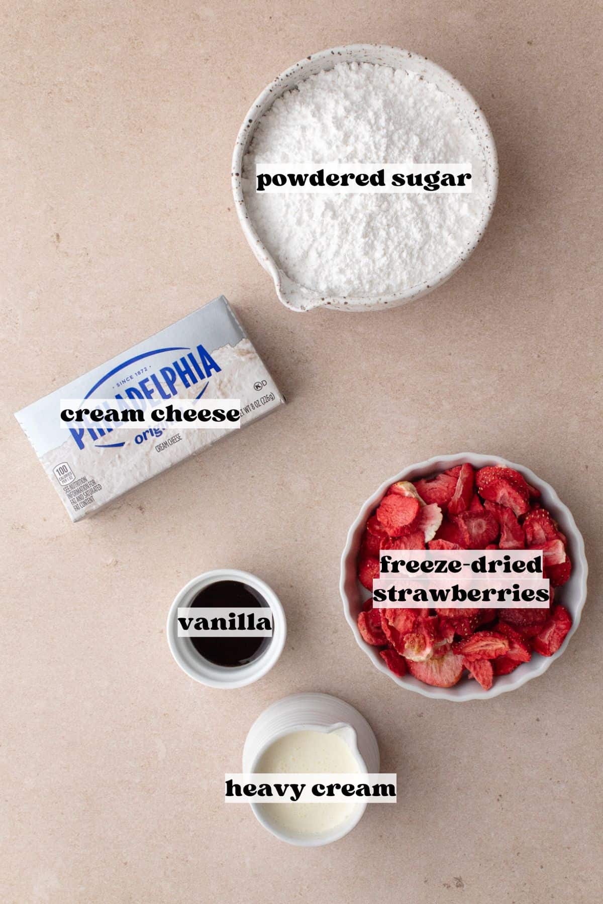 Strawberry cheesecake cream filling ingredients, which include cream cheese, heavy cream, powdered sugar, freeze-dried strawberries and vanilla paste.