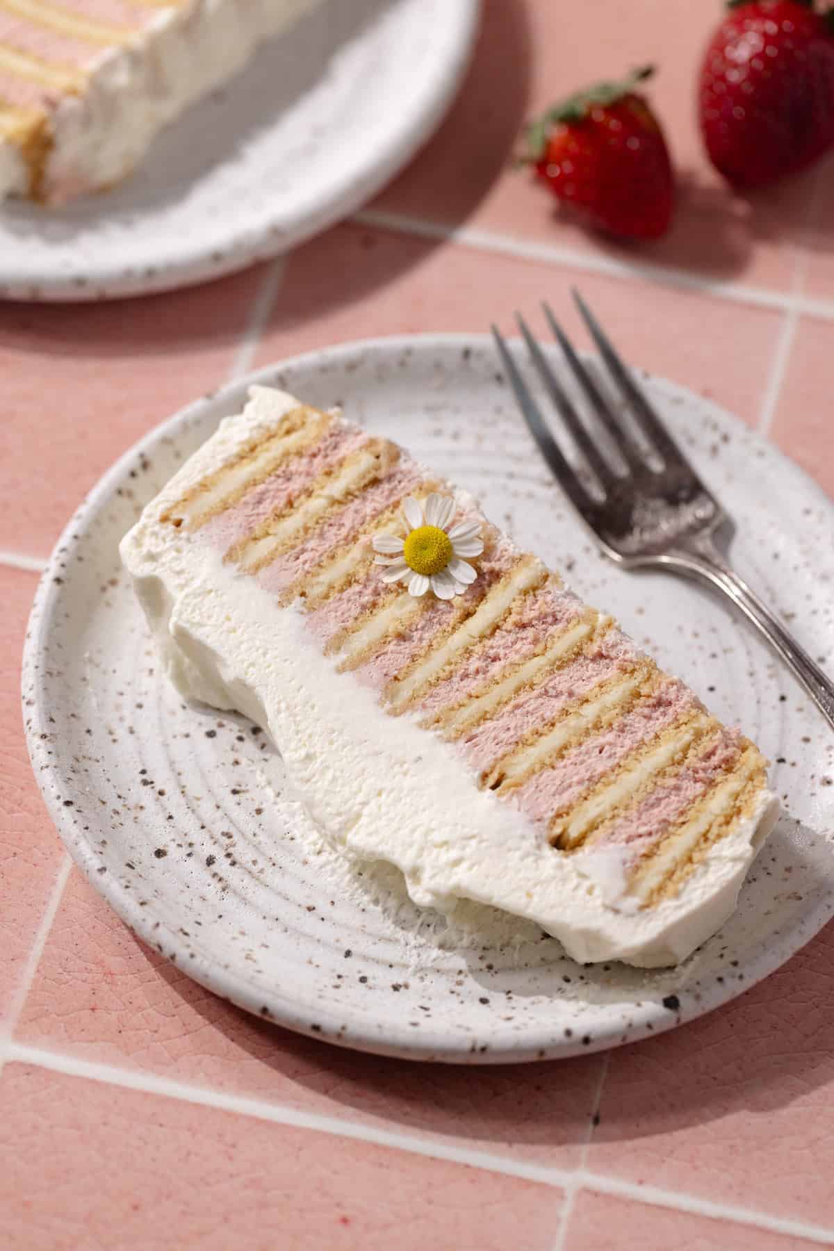 A slice of easy, no-bake strawberry icebox cake on dessert plate.