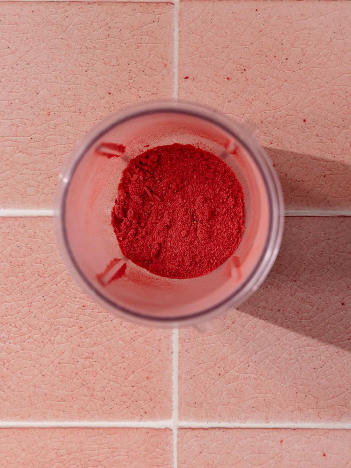 Freeze-dried strawberries are grind to a fine powder.