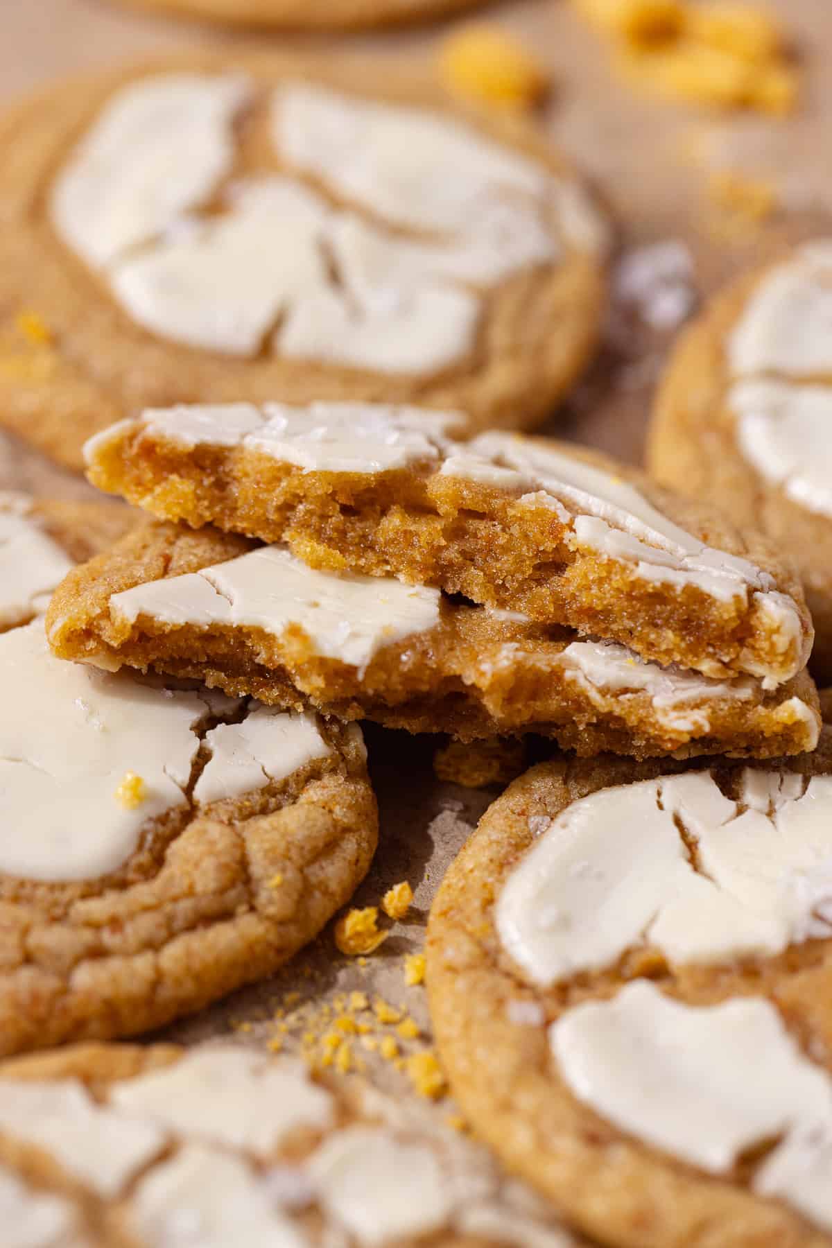 Captain Crunch cookies topped with white chocolate sitting on a wire rack.