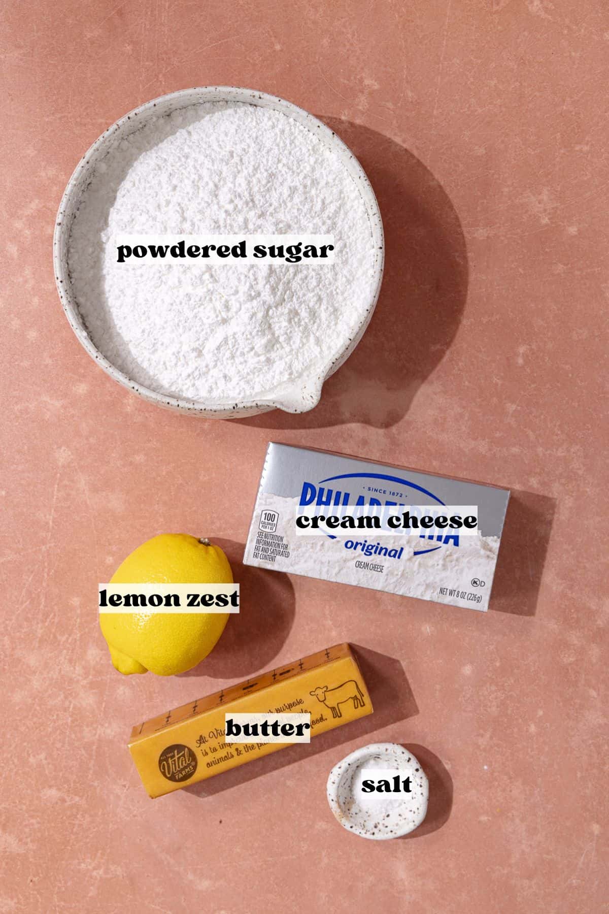 Lemon cream cheese frosting ingredients which include, powdered sugar, cream cheese, butter, lemon zest and salt.