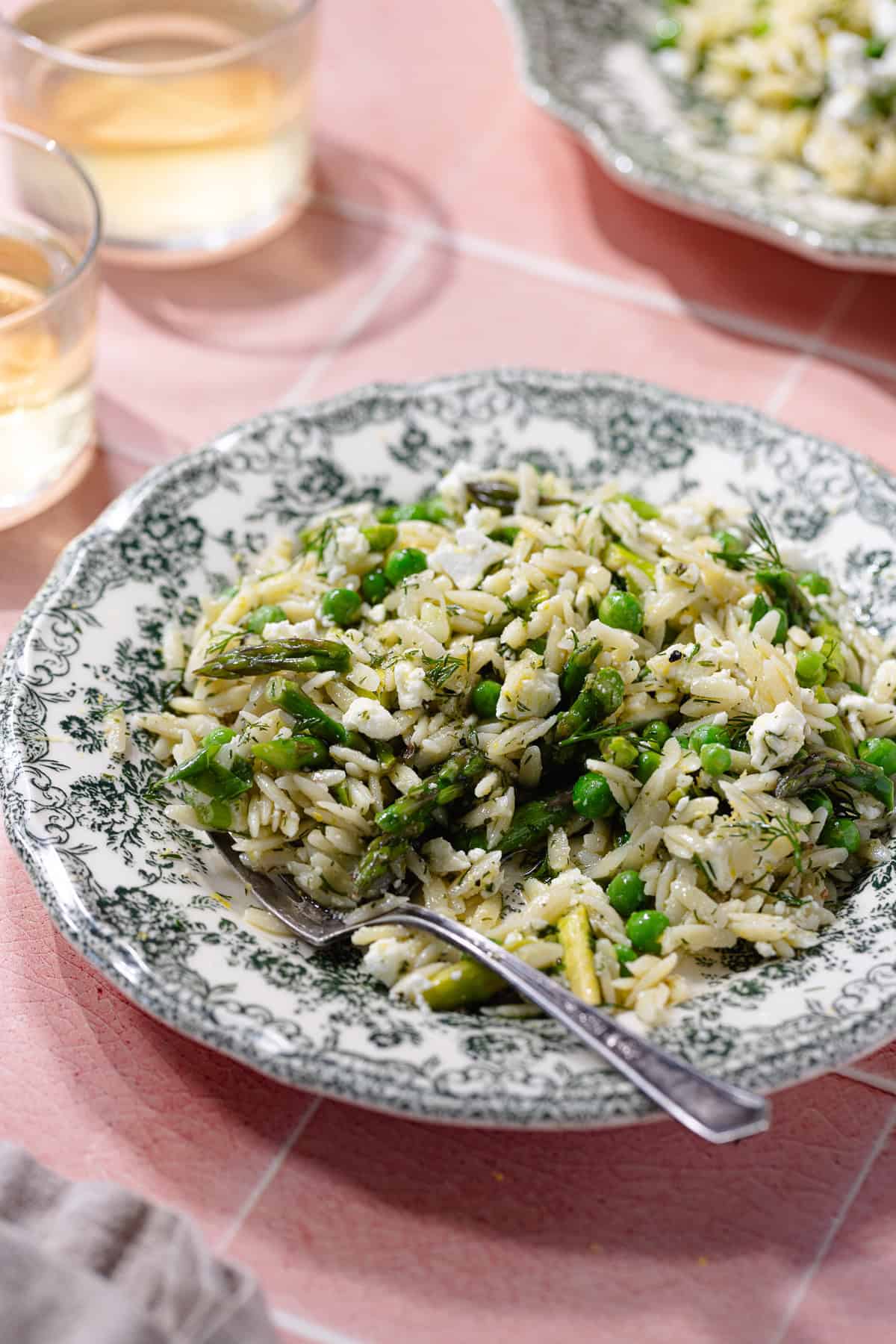 Spring orzo pasta salad on a plate.