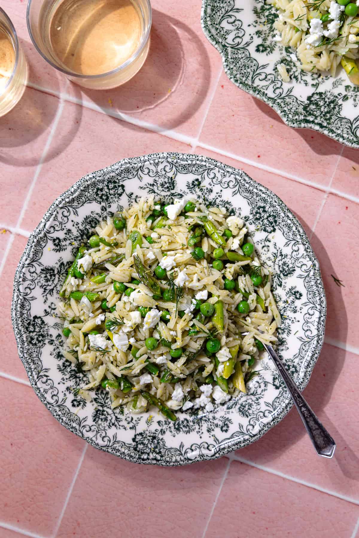 Spring orzo pasta salad on a plate.